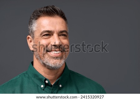 Happy middle aged business man entrepreneur, smiling mature professional confident businessman leader investor wearing green shirt looking aside isolated on gray, headshot close up portrait. Royalty-Free Stock Photo #2415320927