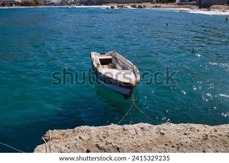 Small boat at Zeus Bay in the Aegean Sea 