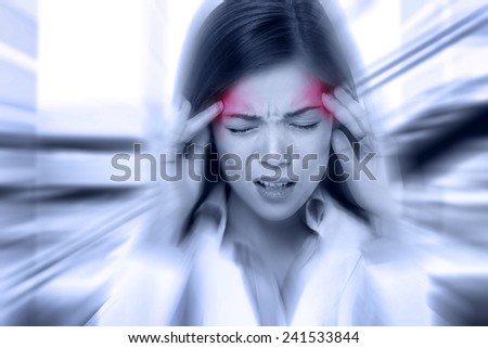 Headache migraine people - Doctor woman stressed. Woman Nurse / doctor with migraine headache overworked and stressed. Health care professional in lab coat wearing stethoscope at hospital. Royalty-Free Stock Photo #241533844
