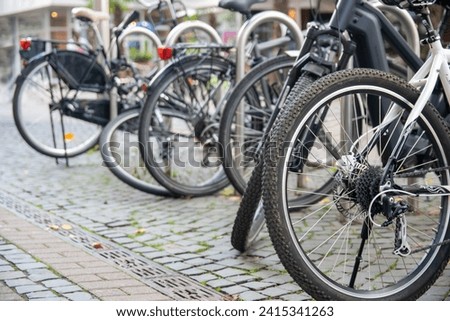 Urban streets with bikes. Bikes stay on Bicycle parking in Germany.