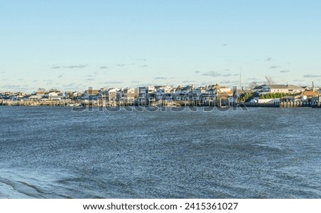 Houses and docks on the water in Point Lookout  Long Island, NY Royalty-Free Stock Photo #2415361027