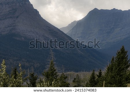 Beautiful landscape with stormy clouds and fog in Glacier NationalPark, Montana.