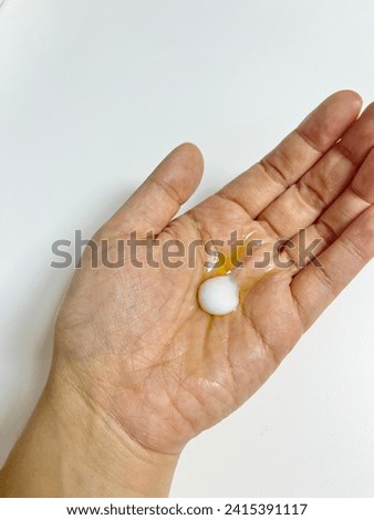 Cosmetic lotion in women's hands