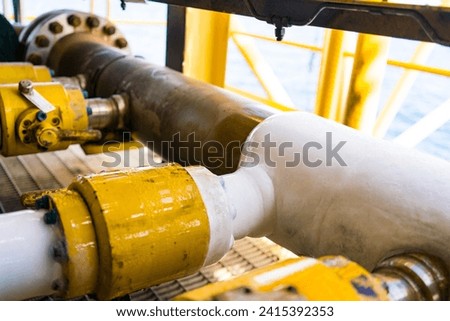 Pipes that have ice build up are caused by liquids inside the pipes or gas flowing, causing low temperatures to drop below zero. Royalty-Free Stock Photo #2415392353