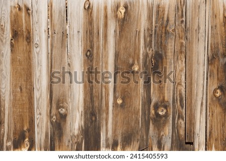 old dry weathered brownish gray wooden planks board surface - full frame background and texture.
