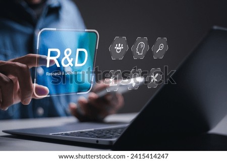 R and D, Research and Development concept. businessman use laptop with virtual R and D icons for research and development of business science technology. Royalty-Free Stock Photo #2415414247