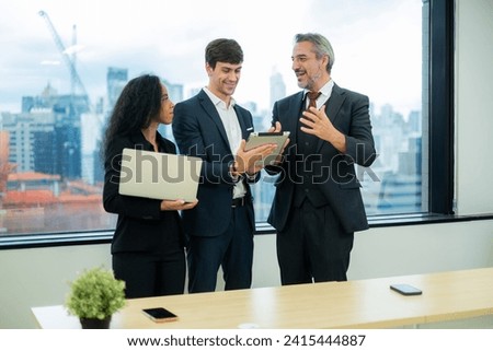 Group of businesspersons standing and talking about work, A group of business people partners during a set team meeting in the modern office.High quality.