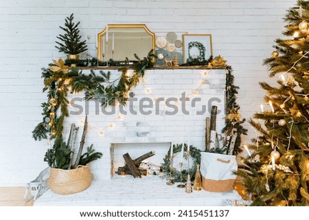 Interior picture. New year and Christmas. Festive Christmas tree near the fireplace, garland of spruce branches, garland and balls. High quality photo