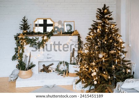 New year and Christmas. Interior picture.Festive Christmas tree near the fireplace, garland of spruce branches, garland and balls. High quality photo