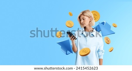 Blonde woman with phone in hand, blue arrow with coins falling on empty copy space background. Cashback and money return in online shopping. Concept of refund and banking Royalty-Free Stock Photo #2415452623