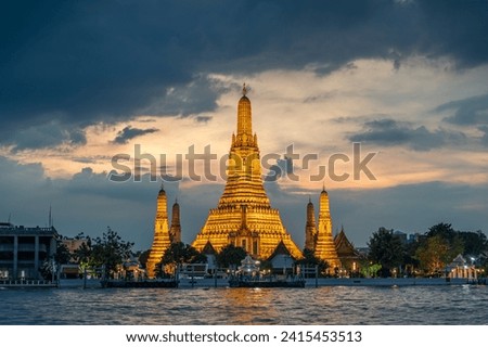 Wat Arun Ratchawararam (the Temple of Dawn) at sunset, one of the famous place in Bangkok, Thailand Royalty-Free Stock Photo #2415453513