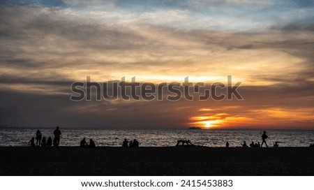 Panoramic beautiful colorful golden hour twilight sky. silhouettes, people meet sunset in tropics, Thailand, Pattaya. Beautiful cloud and sky nature background in magic hour Royalty-Free Stock Photo #2415453883