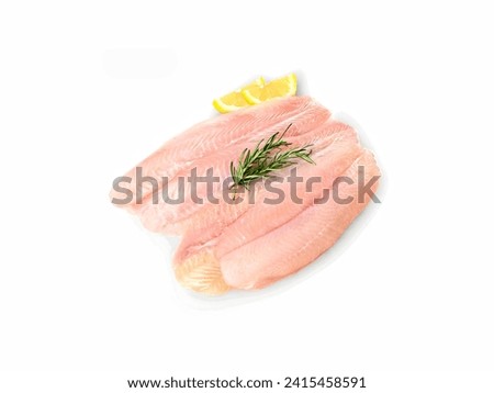 Haute Ocean. Fresh Fish Fillets Adorned with Zesty Lemon and Fragrant Rosemary on a Pristine White Canvas, Emanating the Essence of Fine Dining and Culinary Craftsmanship in a Captivating Visual Ode  Royalty-Free Stock Photo #2415458591