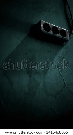 
Dark-themed electrical outlet In the moody ambiance
