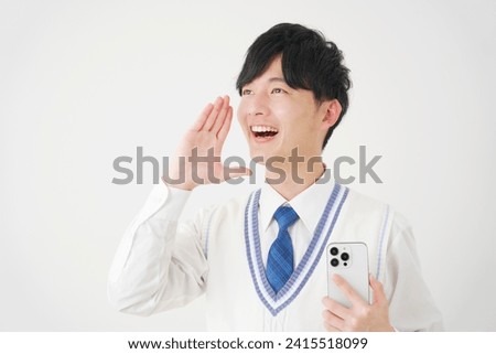 Asian high school boy with the smartphone encouraging in white background