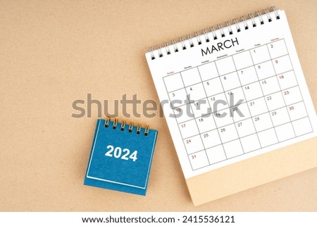 March 2024 desk calendar on brown color background, position with copy space. Time planning day concepts.