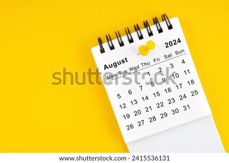 August 2024 Monthly desk calendar for 2024 year with thumbtack on yellow background. Royalty-Free Stock Photo #2415536131