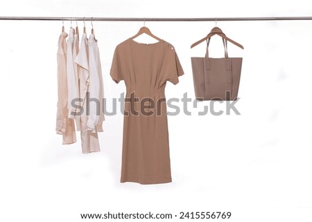 Brown dress and jacket with white shirt  with brown handbag  on hanger	