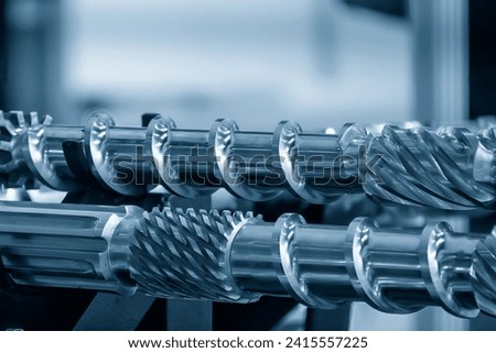 Close up scene  group of the barrel screw of injection machine spare parts. The manufacturing concept injection machine . Royalty-Free Stock Photo #2415557225