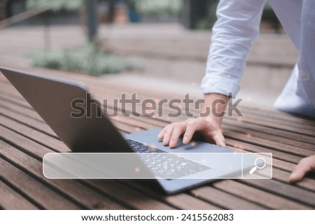 man hand touching on tack pad computer laptop in concept of search engine searching on internet