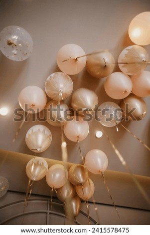 Ceiling Covered In Pink And golden colour Balloon Decorations stock photo