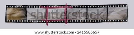 single retro 35mm positive strip printed on white crumpled paper with red selection marker, contact sheet strip with empty frames or film cells. cool cover or poster idea.