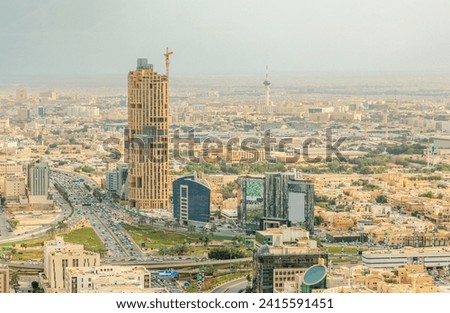 Aerial panorama of residential areas of Riyadh city with tv tower in the background, Al Riyadh, Saudi Arabia Royalty-Free Stock Photo #2415591451
