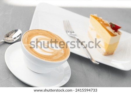 Side view of hot latte coffee with latte art in a ceramic green cup and saucer isolated on white background with clipping path inside. Image Stacking Techniques, Coffee cup and beans on a white back