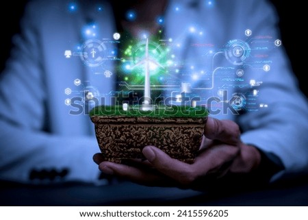 Businessman touch screen management by Ai holographic concept green Energy from wind turbine systems, renewable energy, reducing electricity use, saving energy, sustainable energy conservation