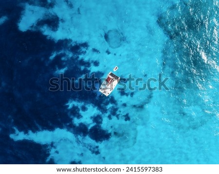 Drone view of a sailing yacht. Luxury transportation. Vacation and holidays. Summer time for sea travel. The sea bay. Photo for background and wallpaper. 