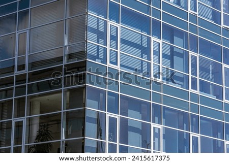 Modern glass office building in an expensive area of Copenhagen, Denmark. High quality photo Royalty-Free Stock Photo #2415617375