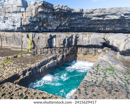 The famous Poll na bPéist - The Wormhole, Inishmore on Aran islands in Ireland Royalty-Free Stock Photo #2415629417