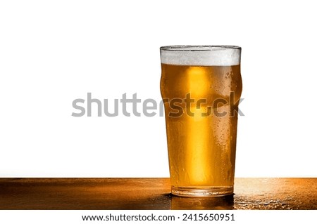 A cold crisp pint of beer on a clean background with copyspace