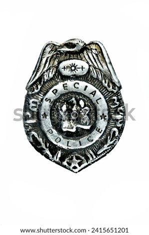 An old police badge isolated on a white background