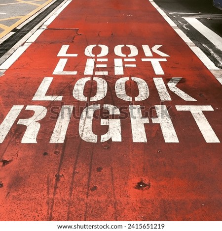 A sidewalk sign displaying the words "Look Right Look Left". Sydney, Australia