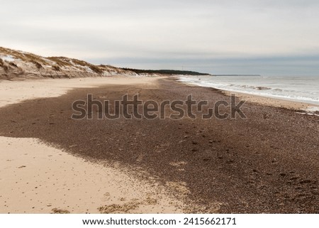 sea ​​of ​​stones on the beach in winter