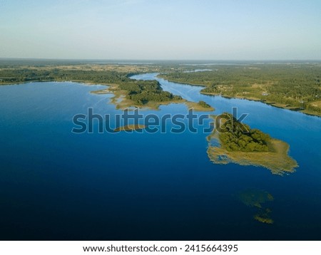An aerial shot of islets in the middle of Siesartis lake in Lithuania