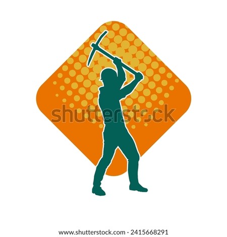 Silhouette of a man in worker costume carrying pick axe tool in action pose. Silhouette of a miner in action pose with pick axe tool. Royalty-Free Stock Photo #2415668291