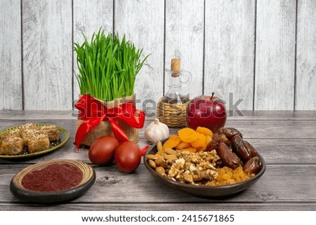 The vernal equinox, a traditional table on Navruz. wheat grass, Arabic baklava dessert, sweets, nuts, dried fruits