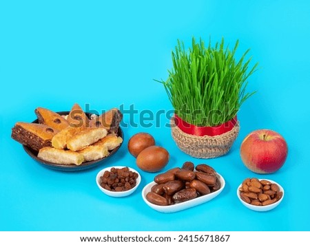 The vernal equinox, a traditional table on Navruz. wheat grass, Arabic baklava dessert, sweets, nuts, dried fruits