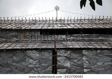 Exterior photo view of a detail of a temporary local chinese theater building made of bamboo and metal sheets for a folk chinese opera theater show in a village in Hong Kong