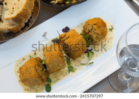 Prepared tasty andouillette artisanale from casings served at plate, french cuisine