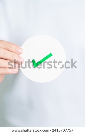 Woman show Right symbol paper. True and false, accept and rejected, evaluation, Vote, Poll, Yes or No and Survey concepts Royalty-Free Stock Photo #2415707757