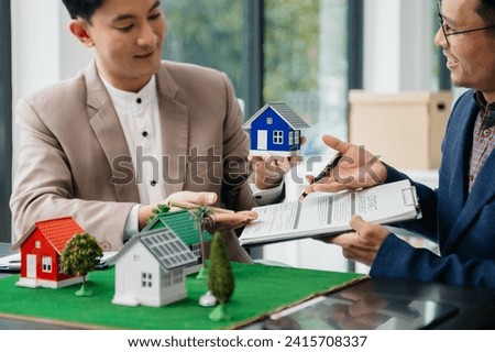 Sales giving male customer signing sales contract, Asian man doing business concept and contract signing.
