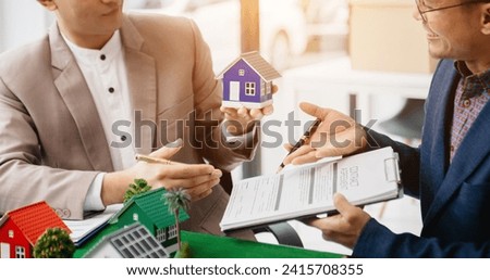 Sales giving male customer signing sales contract, Asian man doing business concept and contract signing.
