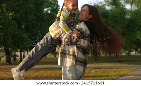 child girl daughter runs into mother arms, child mother happy face, children superhero game, happy family, children's pilot pilot flight air, child empathy, together, respect parent, mommy make Royalty-Free Stock Photo #2415711631