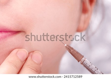 A woman getting an injection in her mouth