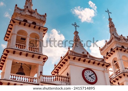 Two towers and clock of parish of San Cristóbal in Mazamitla, lower angle. Royalty-Free Stock Photo #2415714895