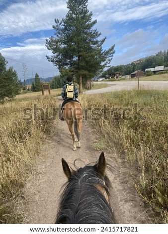 Soul Searching on Horseback in the calming state of Colorado Royalty-Free Stock Photo #2415717821