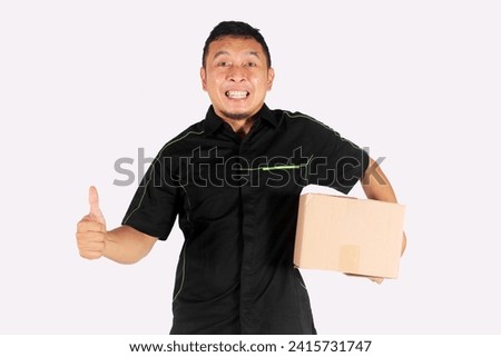 Man Carrying Pile of Heavy Cardboard Boxes Isolated with shock and wow expression with thumbs up